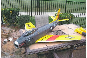Image: A scale model of a U.S. Navy F-86 Sabre fighter plane