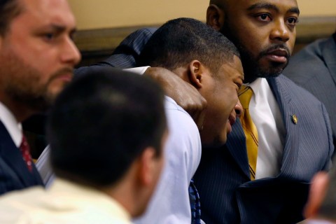 Defense attorney Madison comforts Richmond as Richmond reacts to the verdict during his trial at the juvenile court in Steubenville, Ohio.