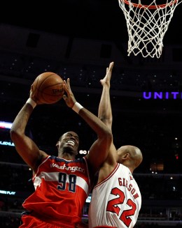 From Left: Washington Wizards' Jason Collins goes to the basket against Chicago Bulls' Taj Gibson in Chicago, on April 17, 2013.