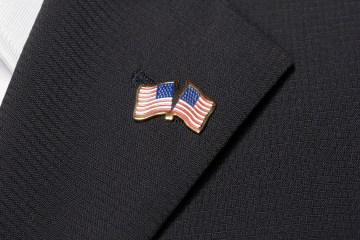 Close up of American flag pin on lapel