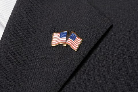 Close up of American flag pin on lapel