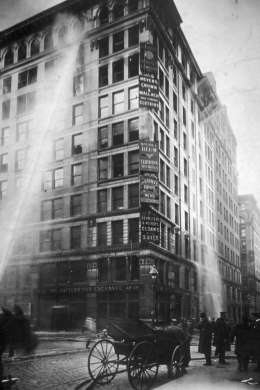 Firefighters work to douse the flames at the Triangle Shirtwaist Company in the Asch building at the corner of Greene Street and Washington Place in New York City, on March 25, 1911.