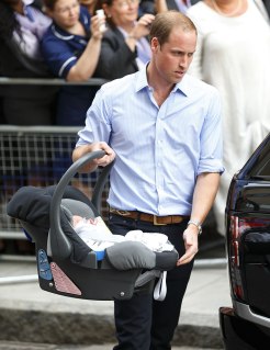 Prince William, Duke of Cambridge carries his newborn son as he and Catherine, Duchess of Cambridge leave The Lindo Wing at St Mary's Hospital in London, on July 23, 2013.