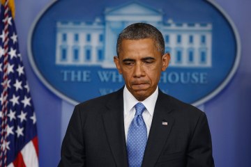 President Barack Obama pauses as he talks about the Trayvon Martin shooting in the press briefing room at the White House in Washington, July 19, 2013.