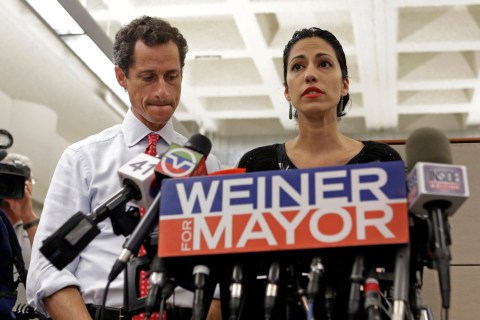 From left: New York mayoral candidate Anthony Weiner listens as his wife, Huma Abedin, speaks during a news conference at the Gay Men's Health Crisis headquarters in New York City, on July 23, 2013.