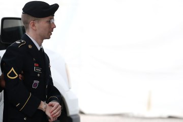 U.S. Army Private First Class Bradley Manning is escorted by military police as he arrives for his sentencing at military court facility for the sentencing phase of his trial on August 21, 2013 in Fort Meade, Md.