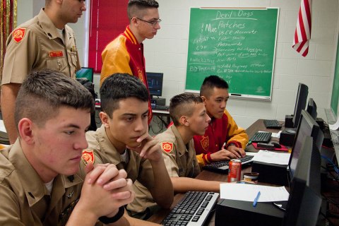 A CyberPatriot team of six Marine Military Academy cadets hacks into vulnerabilities in computer operating systems on Saturday, Jan. 14, 2012, as part of the Cyber Patriot National High School Defense competition, in Harlingen, Texas.