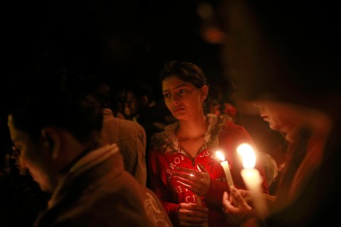 Demonstrators hold candles during a candlelight vigil for the gang rape victim who was assaulted in New Delhi, on Dec. 30, 2012.