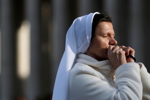 A nun prays in Saint Peter's Square