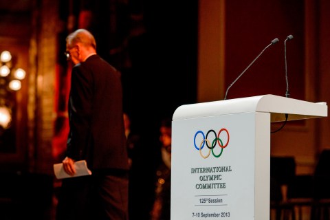 International Olympic Committee President Jacques Rogge leaves the stage after giving an inaugural speech at the opening ceremony of the 125th IOC Session at the Teatro Colon opera house in Buenos Aires, on Sept. 6, 2013.