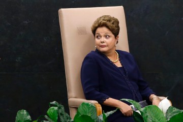 Brazil's President Dilma Rousseff reacts to someone as she waits to address the 68th United Nations General Assembly at U.N. headquarters in New York