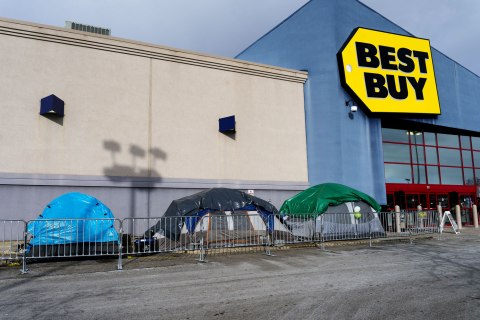 Customers set up tents in anticipation of Black Friday sales at Best Buy in Cuyahoga Falls, Ohio, November 24, 2013.